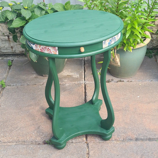 Beautifully finished furniture, created by a beginner, green side table with gold knob and wallpaper decoupaged detail, achieved at The Furniture Bureau.