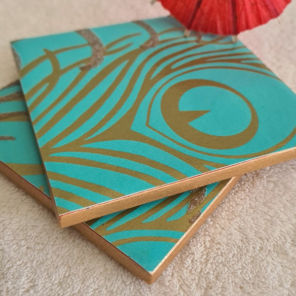 Stunning teal and gold peacock feather design on ceramic coasters, gold edges, cork backed.  Slightly textured design with glitter by Shel's Shabby Chic.