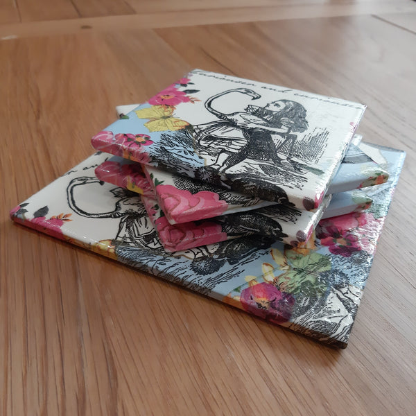 Alice in Wonderland handmade coasters and bottle stand stacked together as totally unique tableware.