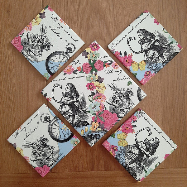 One-of-a-kind Alice in Wonderland ceramic set with four handmade coasters and matching bottle stand.