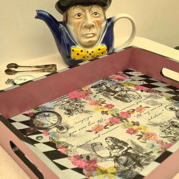 Handcrafted pink Alice in Wonderland wooden serving tray with integrated handles and harlequin edging.