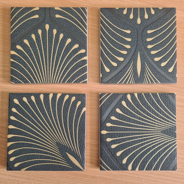 Set of four handmade Art Deco Fan ceramic coasters with bronze metallic edging.