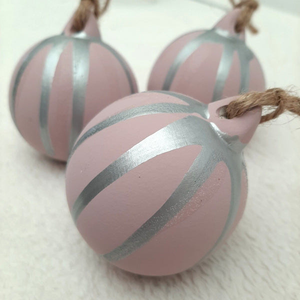 Bespoke pink and silver hand-painted Christmas baubles with decorative drizzle, subtle glitter detail