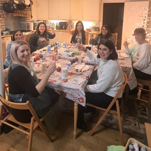 Cheers!  Seven Baubles and Bubbles party goers raising their prosecco glasses after enjoying a creative evening in Stotfold SG5.
