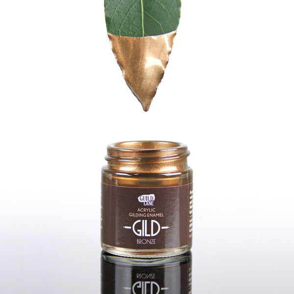 A jar of Guild Lane GILD Originals Bronze metallic enamel paint with warm earthy tones and subtle golden highlights.