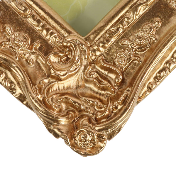 Guild Lane GILD Bronze metallic paint used to highlight detail on a decorative frame.