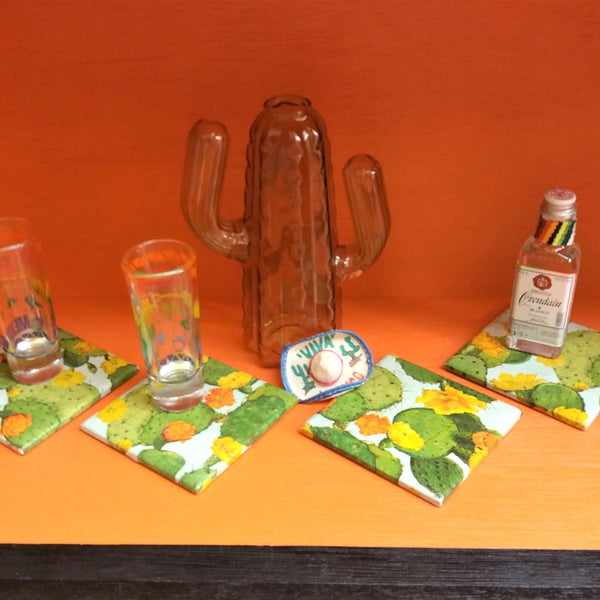 Set of four colourful handmade Cacti ceramic coasters featuring vibrant cactus and succulent designs.