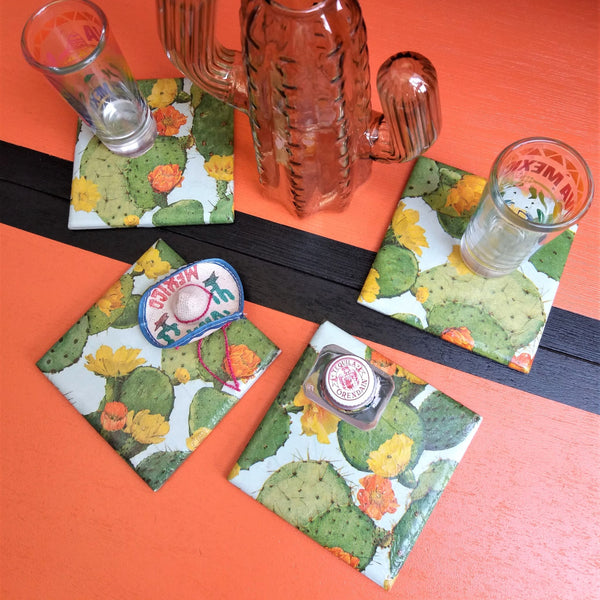 Set of four colourful handmade Cacti ceramic coasters featuring vibrant cactus and succulent designs.