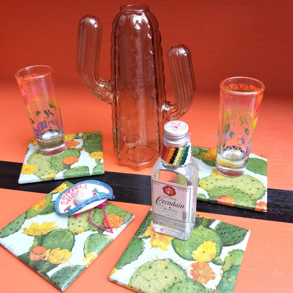 handmade ceramic coaster featuring a vibrant colourful cactus design, styled with Mexican tequila and shot glasses