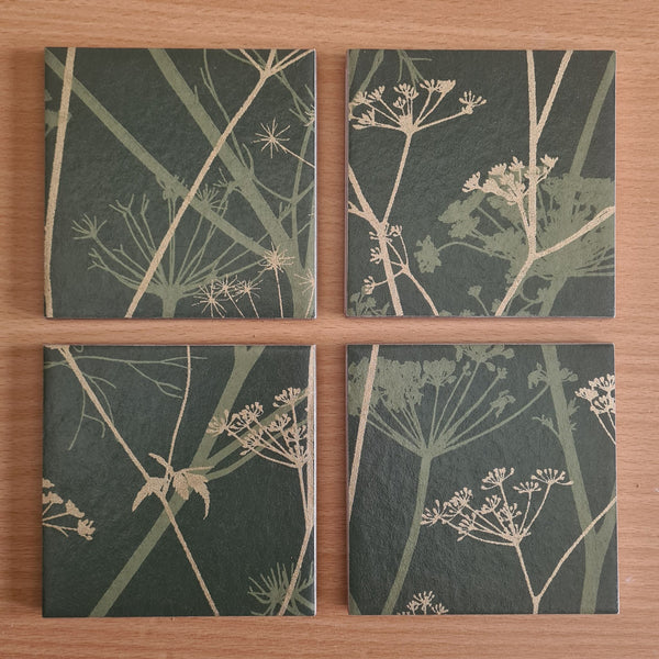 Limited-edition Wild Chervil ceramic coasters arranged to show their individual botanical pattern placement.