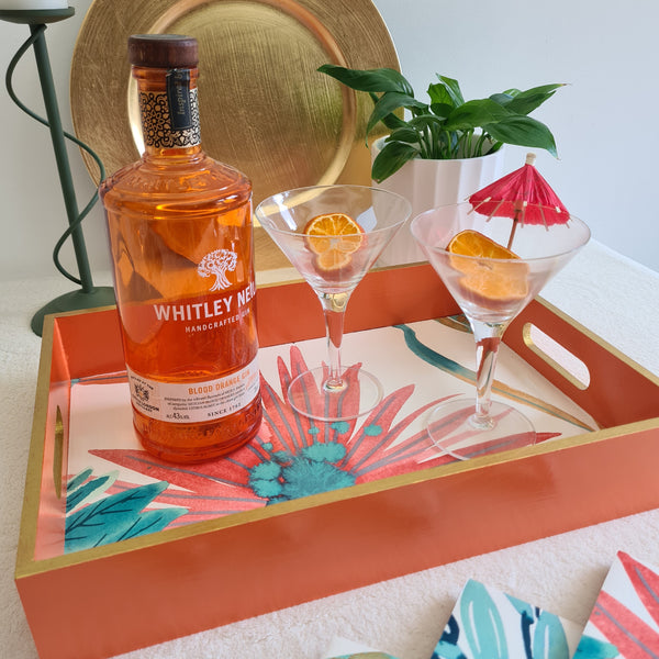 colourful custom made serving tray made using customer's own harlequin yasuni wallpaper, painted in orange with gold edges, created by The Furniture Bureau.