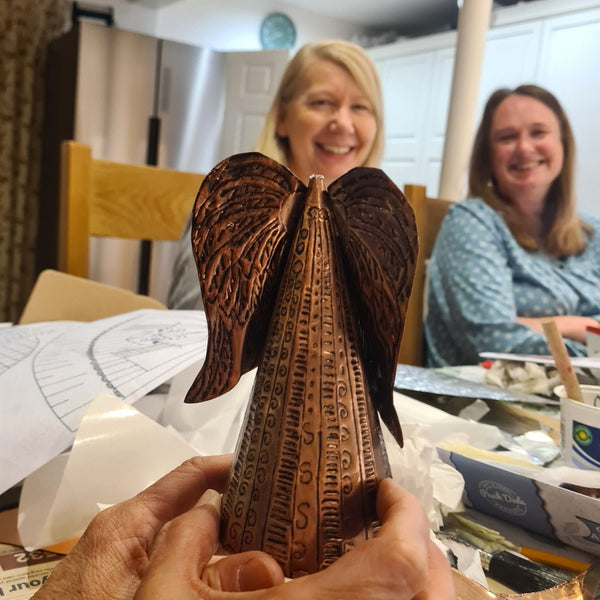 Handmade Copper Angel Christmas tree topper created using a metal embossing craft kit.  The head was attached after the photo!