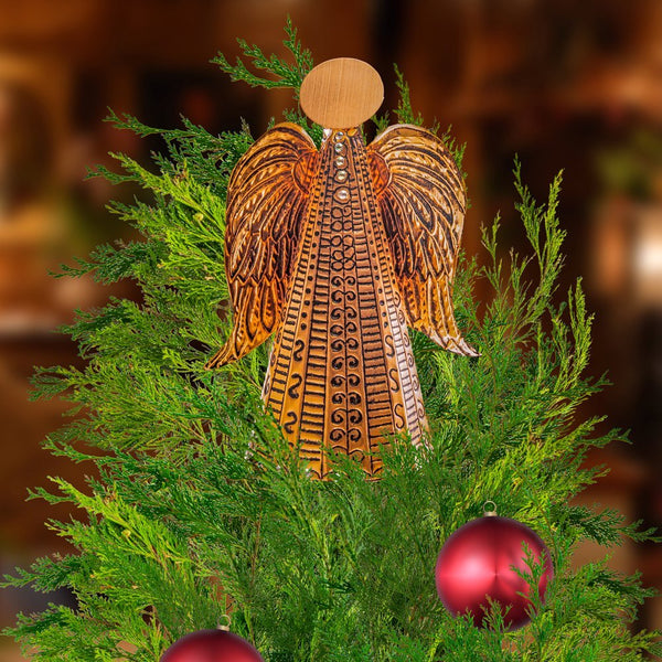A copper angel for your Christmas tree, created at a metal embossing craft class in Stotfold.