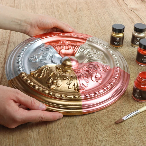 Decorative ceiling rose painted in five Guild Lane GILD metallic finishes: Silver, Bronze, Champagne, Copper and Rose Gold.