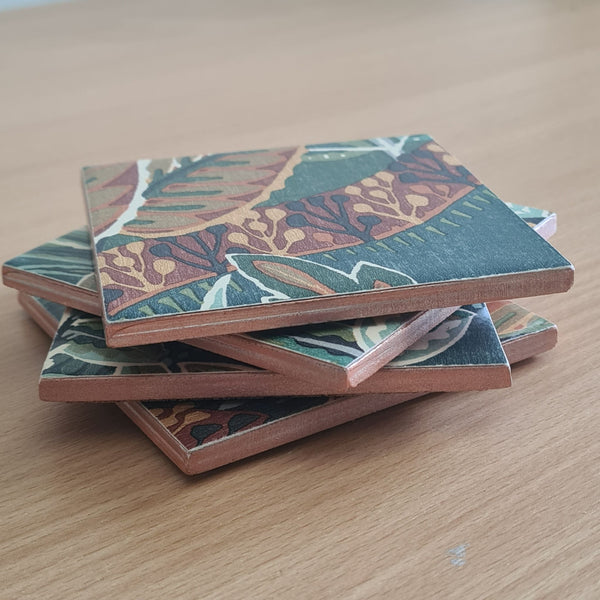Handmade Nature's Exhibitionists ceramic coasters featuring bold botanicals and colourful wildlife.