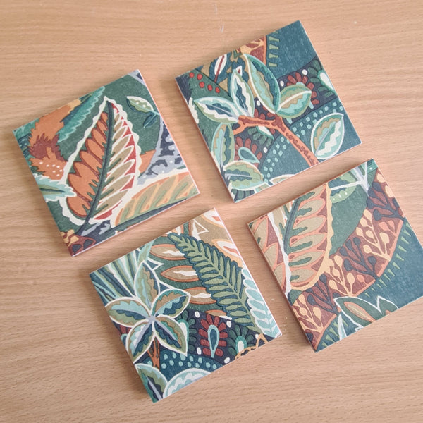 Nature's Exhibitionists ceramic coasters showing different sections of the bold botanical pattern.