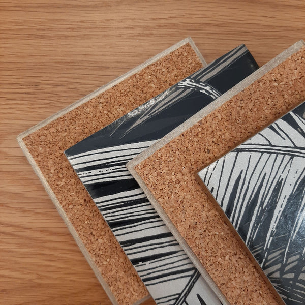 Reverse of Palm Jungle ceramic coasters showing cork backing and metallic edging.