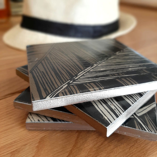 Palm Jungle ceramic coaster showing its complementary hand-painted metallic edging.