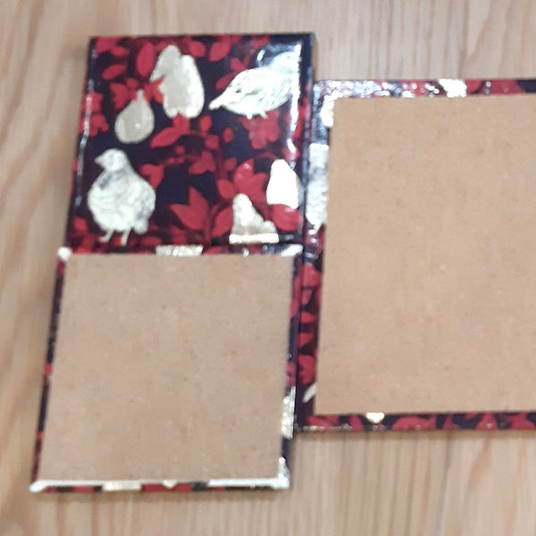 Reverse of handmade ceramic coasters featuring cork backing.