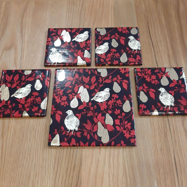 Partridge in a Pear Tree coasters and bottle stand for festive Christmas drinks and entertaining.