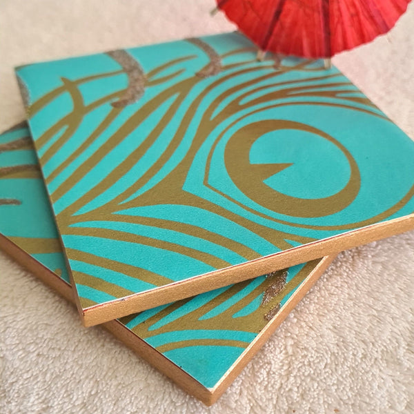 One-of-a-kind pair of handmade Peacock Feather ceramic coasters in rich teal.