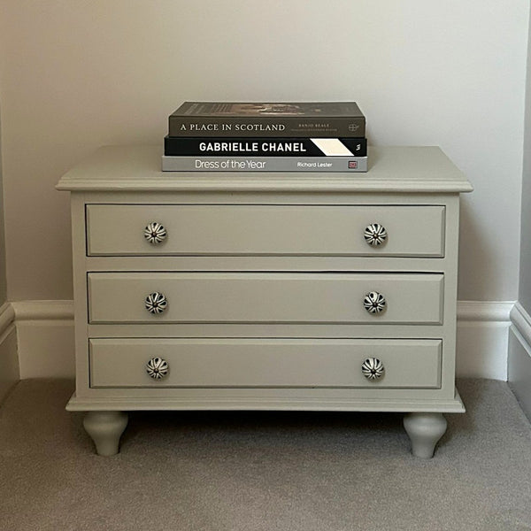 Finished furniture transformation after a 1-to-1 workshop at The Furniture Bureau, a three drawer chest painted in french grey with ceramic handles.