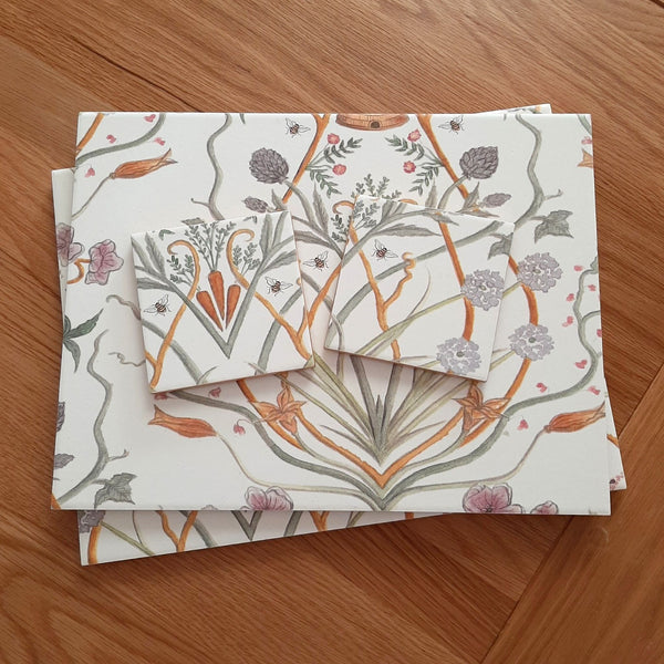 Angel Strawbridge's Potagerie French garden design on handmade ceramic placemats and matching coasters.