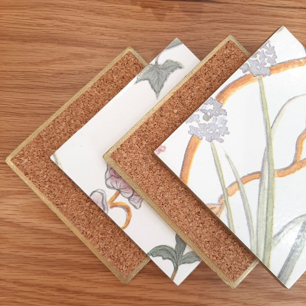 Metallic gold edging and cork backing on a handmade Chateau Potagerie ceramic coaster to help protect furniture.