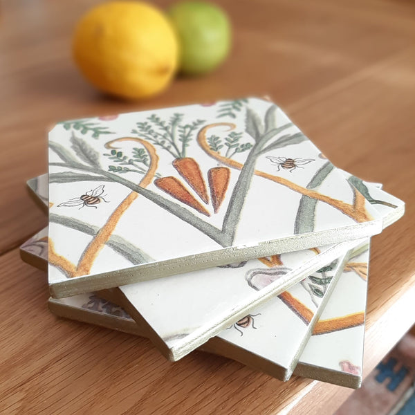 Handmade Chateau Potagerie ceramic coasters featuring vegetables, flowers and bees inspired by the Chateau walled garden.