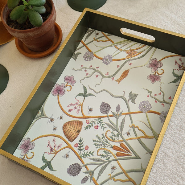 Angled view of The Chateau Potagerie serving tray with rich olive green painted sides and metallic gold edging.