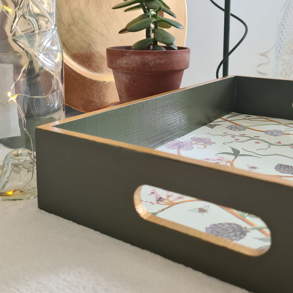 The Chateau Potagerie wooden serving tray with integrated handles and metallic gold edging.