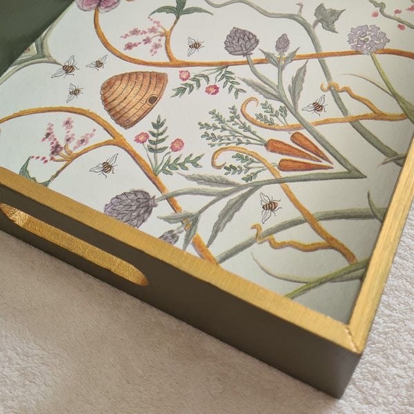 Olive green The Chateau Potagerie wooden serving tray with integrated handles and metallic gold edging.