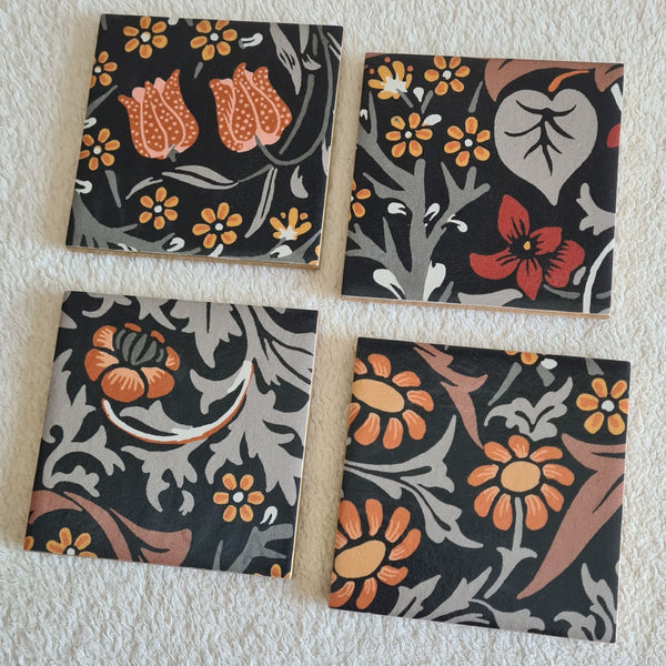 Set of four handmade William Morris Blackthorn ceramic coasters in the Charcoal Grey colourway.