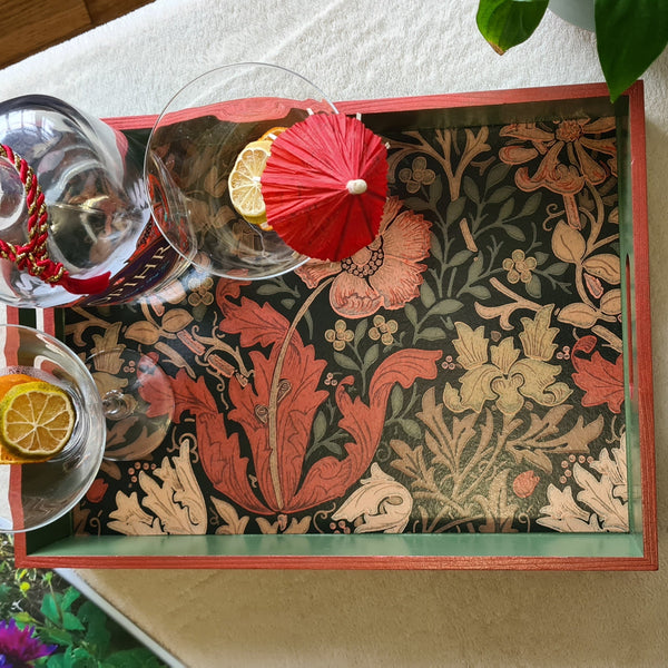 Above view of deep sage green William Morris Compton wooden serving tray with integrated handles and rusty red metallic edging.