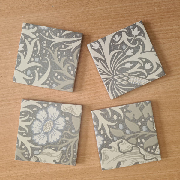 William Morris Seaweed handmade ceramic coasters styled on a coffee table.