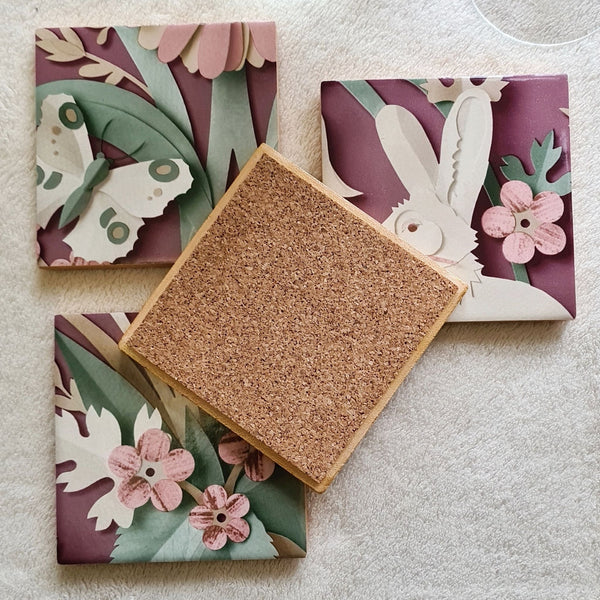 Reverse of Set of four handmade Woodland ceramic coasters featuring cork backing and gold edging details.
