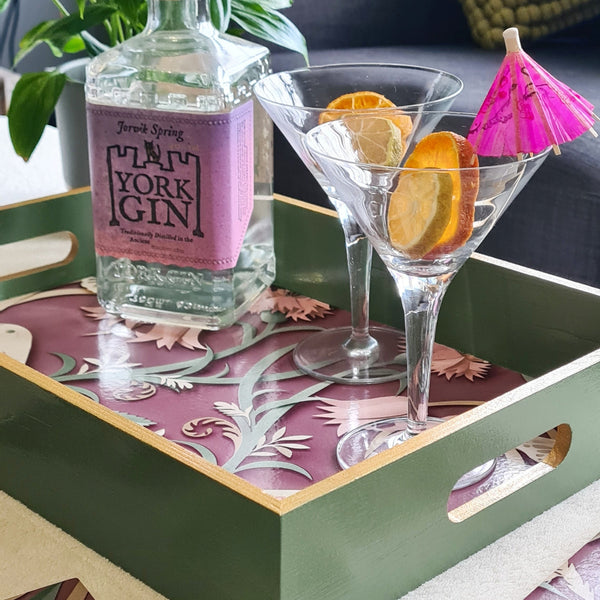 Sage green handcrafted woodland serving tray with integrated handles and metallic gold edging.