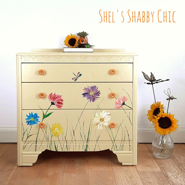 Floella is a mellow yellow mid century Lebus chest of 3 drawers, handpainted with acrylic flowers. Stylish storage for any bedroom.
